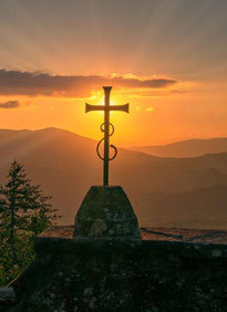 A cross against the sunset — prayer for Ukraine